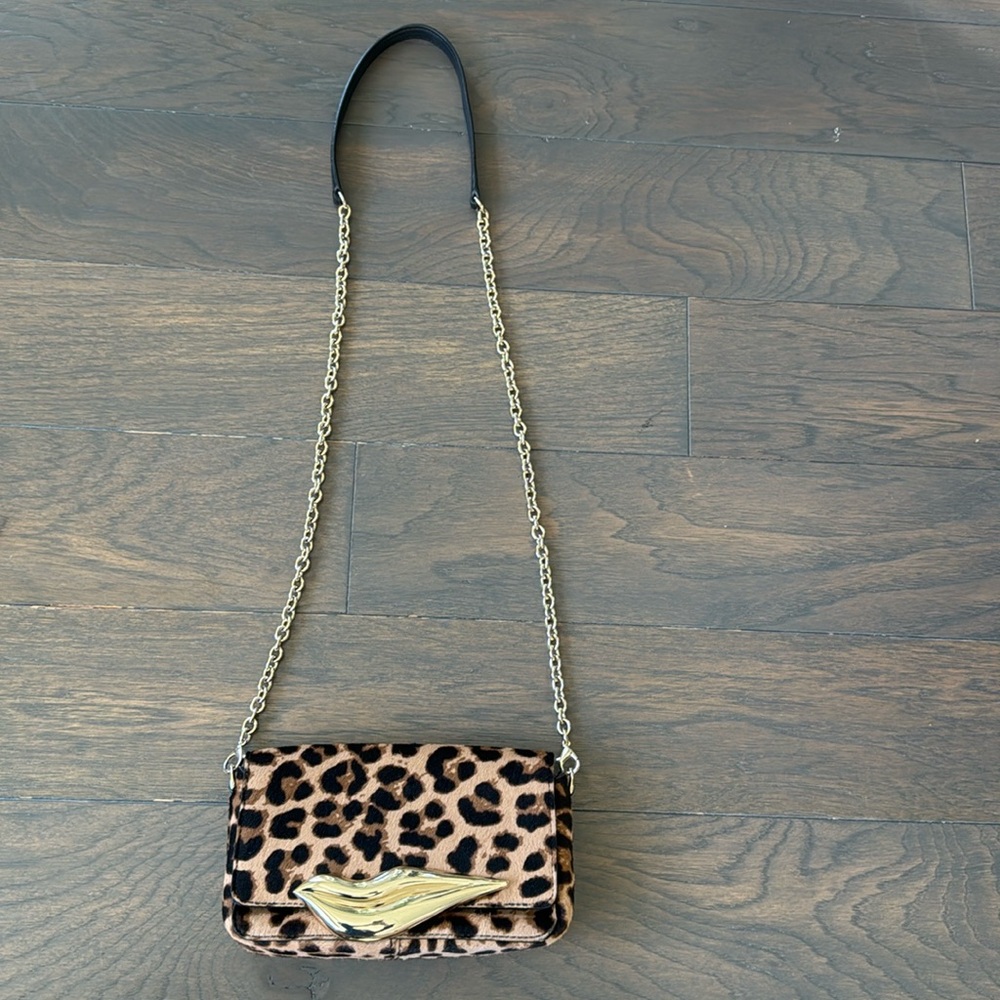 Diane Von Furstenberg “Lips” crossbody bag in leopard print.